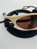 PLANTARIS OAKLEY - AREIA - PRIZM MARROM  (COMPRE UM ÓCULOS E ESCOLHA O SEGUNDO GRÁTIS)