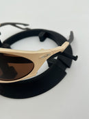 PLANTARIS OAKLEY - AREIA - PRIZM MARROM  (COMPRE UM ÓCULOS E ESCOLHA O SEGUNDO GRÁTIS)