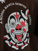 CAMISETA OVERSIZED CHRONIC - A NOSSA BANCA SEMPRE GANHA - MARROM