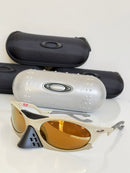 PLANTARIS OAKLEY - AREIA - PRIZM MARROM (COMPRE UM ÓCULOS E LEVE 2)